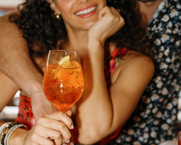 a man and woman enjoying a cocktail