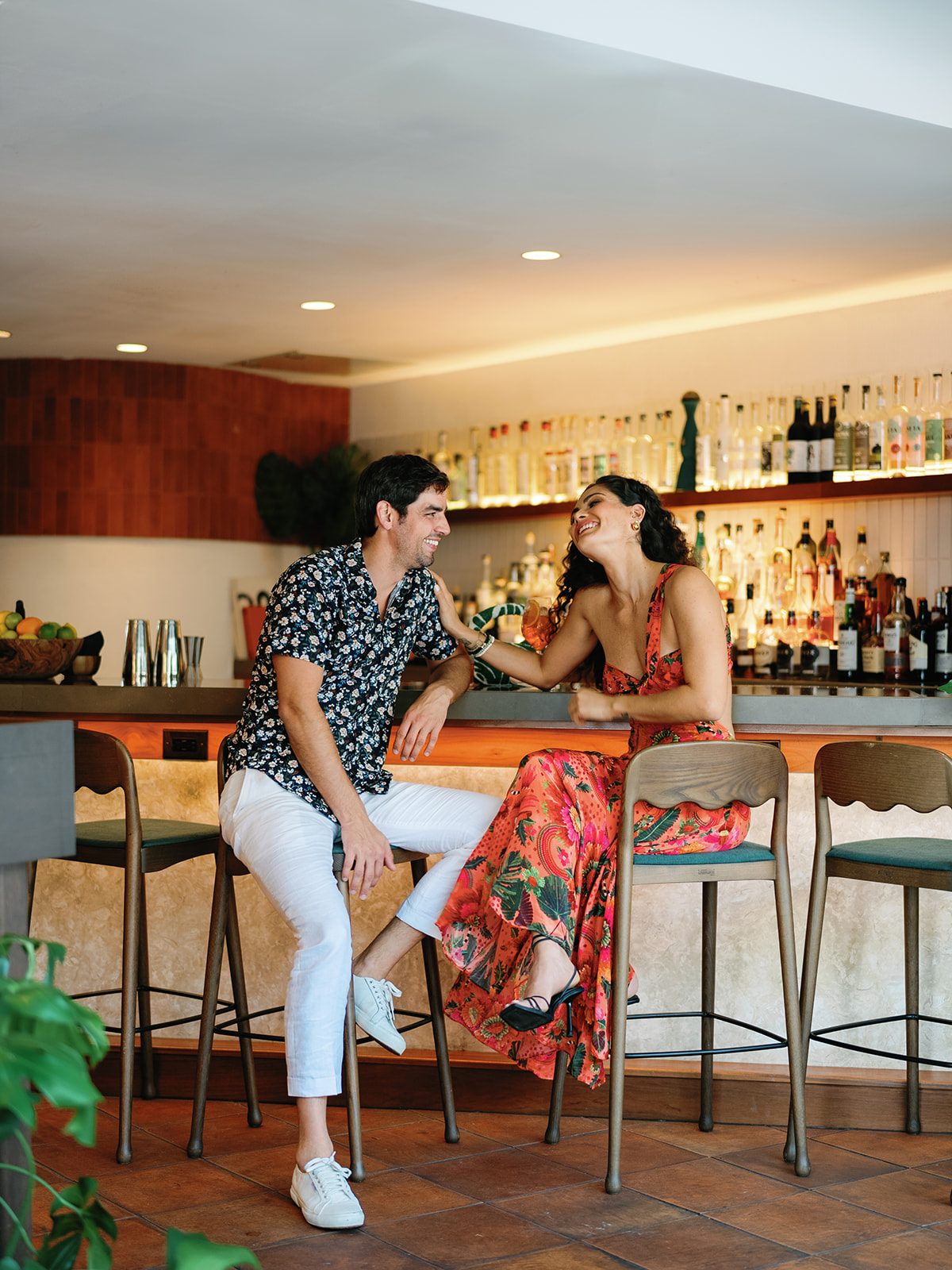 two people sitting at a bar