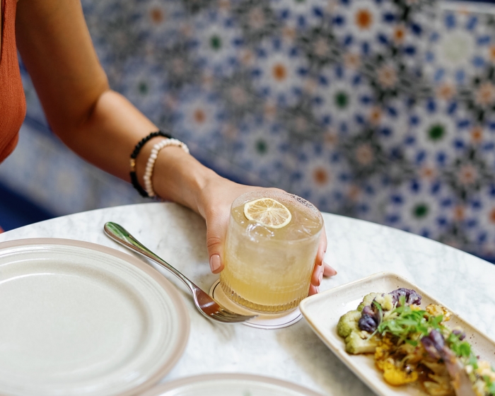 a woman eating at a table
