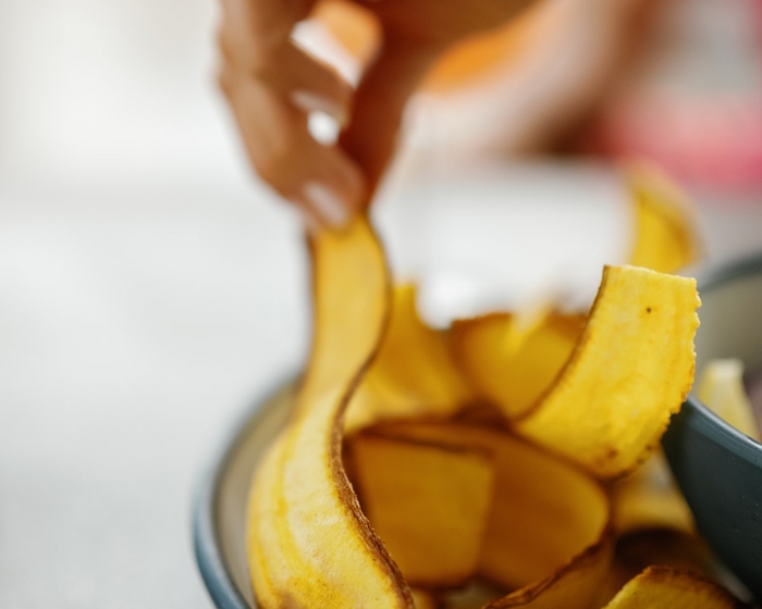 a close up of someone taking food off a plate