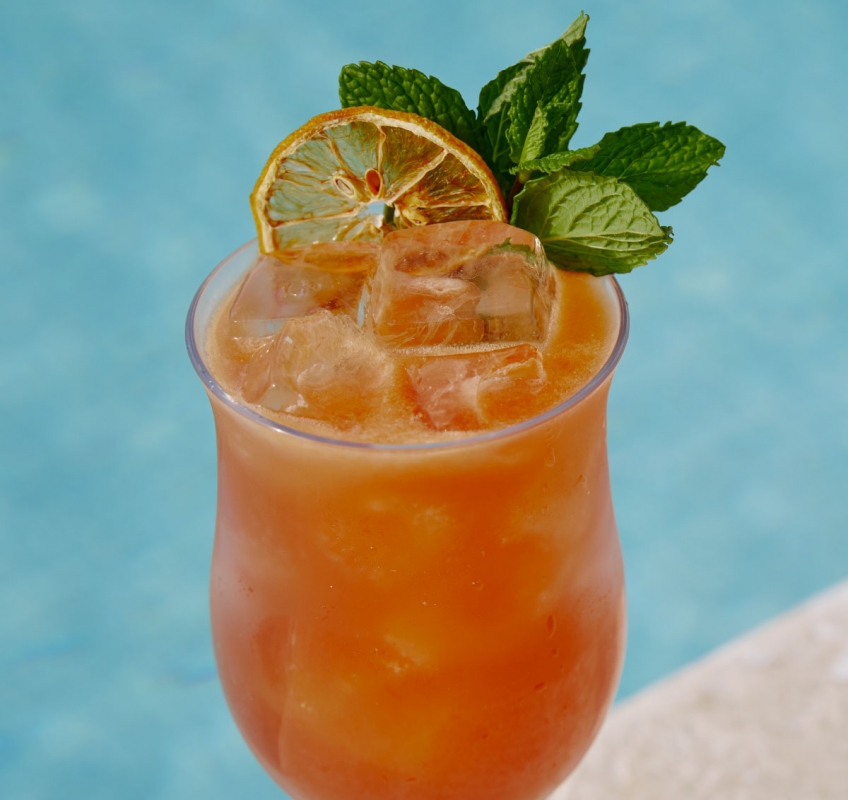 orange cocktail by the pool