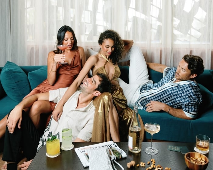 people sitting on a blue couch