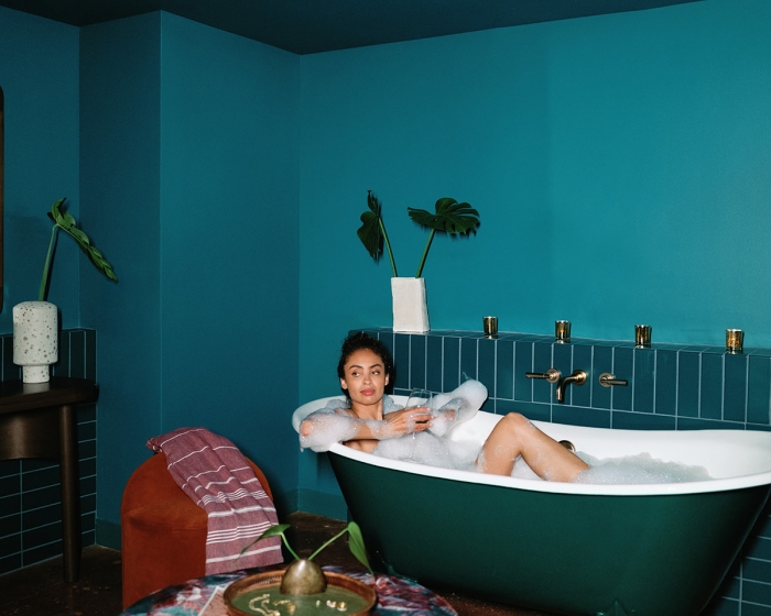 a woman sitting in a tub
