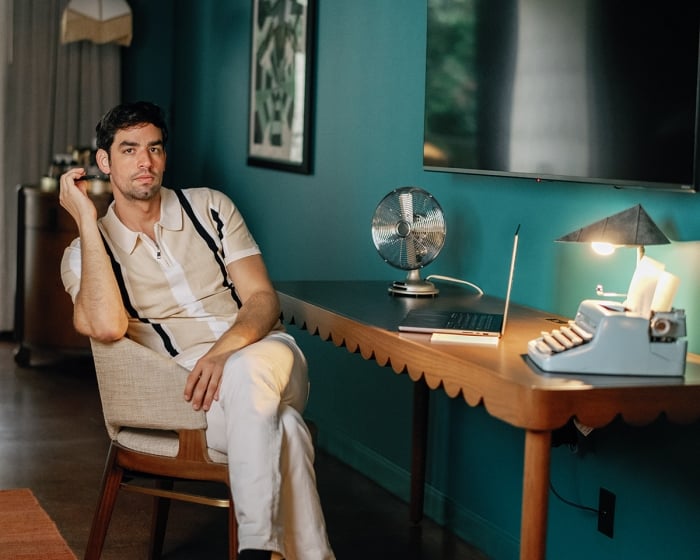 Rooms 4a man sitting at a table