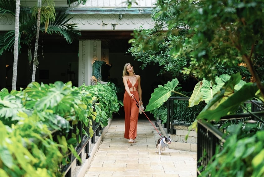a woman walking her dog
