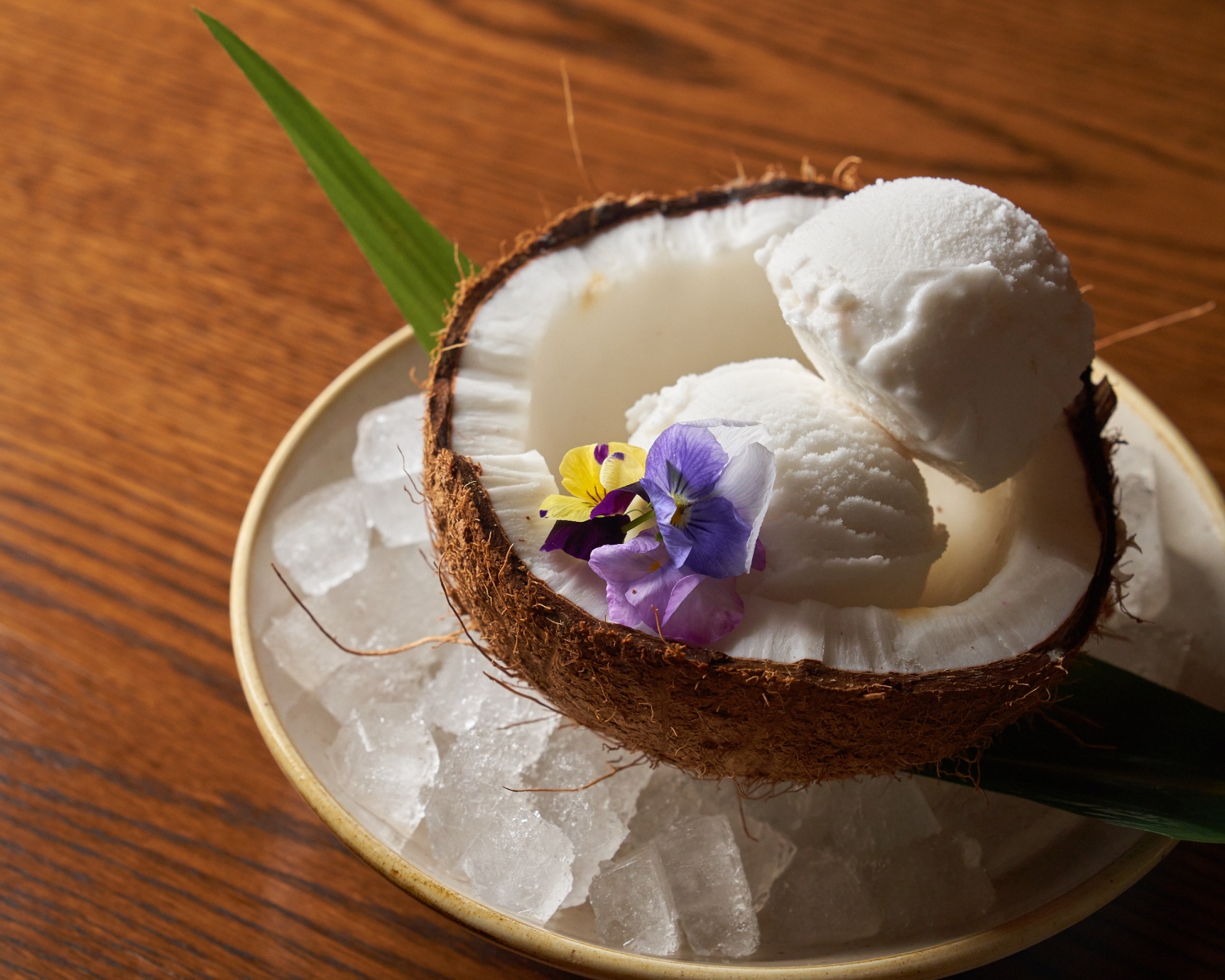 ice cream sitting in half a coconut