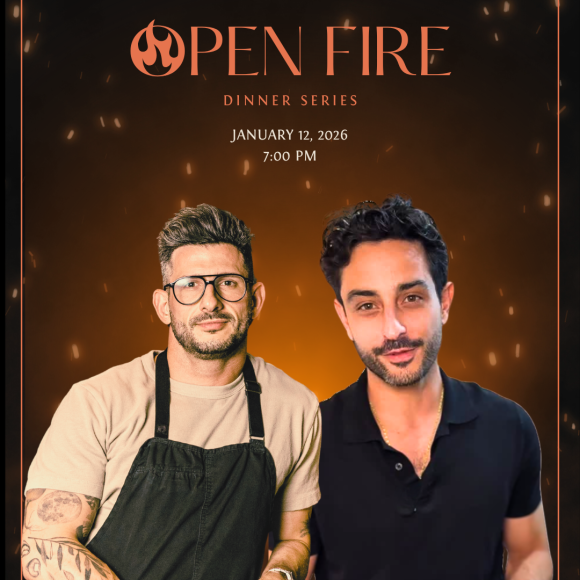Two chefs stand next to one another
